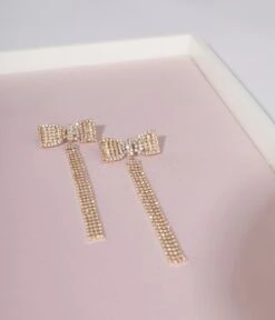 Gold Bow Dangle Earrings -Pleaser Clothing Store gold bow dangle earrings 667926